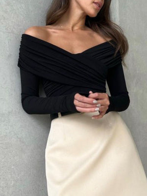 Black off-shoulder bodysuit with long sleeves and ruched detailing.