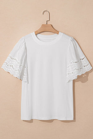 White cotton t-shirt with short flutter sleeves featuring eyelet lace inset details.