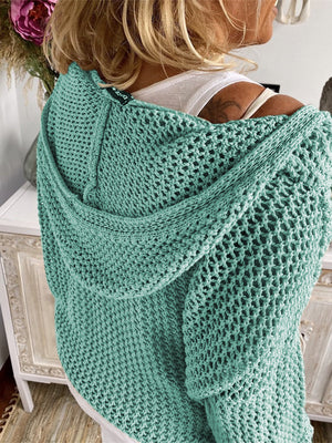 Turquoise open-knit slouchy hooded sweater with a relaxed fit.