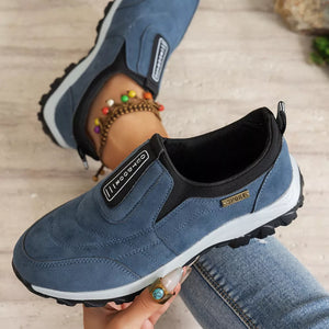 Blue suede-like round toe slip-on sneakers with "Outdoor" and "Sport" details.
