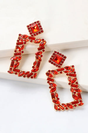 Red geometric jewel box earrings with gold alloy setting and faceted stones.