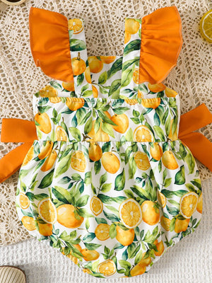 Baby bubble romper with orange and lemon print, ruffled sleeves, and side ties.