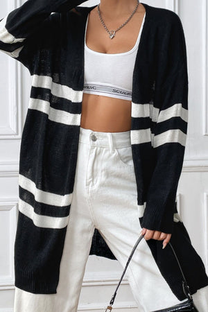 Oversized black and white stripe knit cardigan with open front and long sleeves.