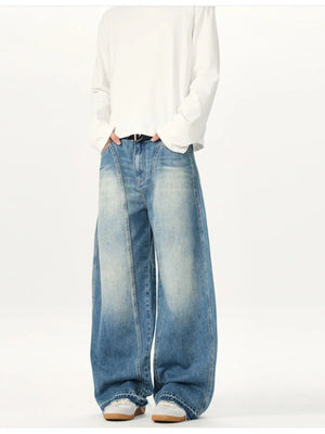Relaxed fit baggy washed cotton jeans in blue denim with a faded look and wide legs.