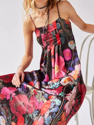 Maxi dress with vibrant floral print, gathered bodice, and spaghetti straps.