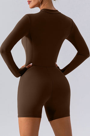 Chocolate performance romper with zip detail, long sleeves, and short legs.
