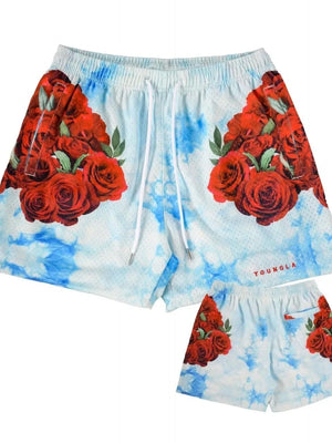 Mesh athletic shorts with red rose floral print on a sky blue tie-dye background.