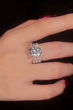 Silver pavé halo moissanite engagement ring with a split band.