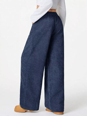 Dark blue corduroy maternity cargo pants with a relaxed fit and wide leg.