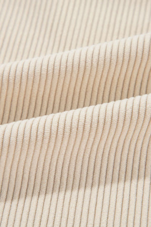 Beige corduroy shacket fabric detail with vertical wales.