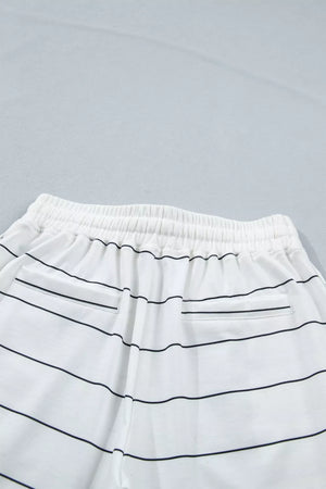 White striped bikini bottoms with drawstring waist and back pockets.