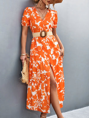 Orange-red floral print midi dress with puff sleeves and a high slit.