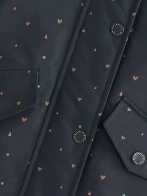 Toddler jacket with allover heart and triangle print, featuring button details and pockets.