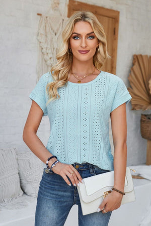 Light blue perforated eyelet cuffed tee with short sleeves and crew neck.