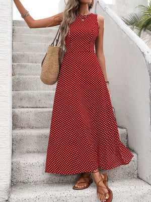 Red polka dot maxi dress with a flattering silhouette and round neckline.