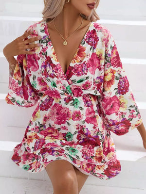 Floral ruffle hem mini dress with a deep V-neck and wide sleeves.