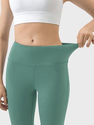 Turquoise high-rise flared sculpt leggings with a wide, flexible waistband.