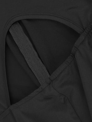 Black romper with cutout back detail and visible zipper.