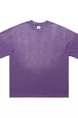 Men's purple oversized vintage t-shirt with a faded wash effect.
