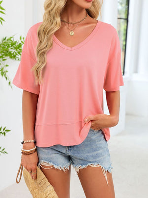 Relaxed fit pink v-neck t-shirt with short sleeves and a layered hem detail.