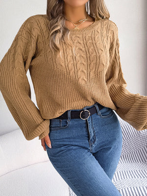 Taupe cable knit drop shoulder pullover sweater with crew neck and balloon sleeves.