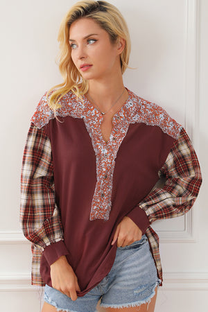 Burgundy mixed media blouse with floral yoke and plaid sleeves.