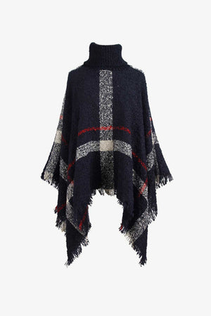Navy plaid turtleneck cape with fringe detail and textured acrylic knit.