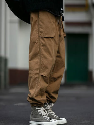 Men's caramel drawstring sweatpants with cargo pockets and elastic cuffs.