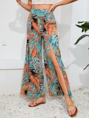 Tropical print palazzo trousers with high slits in multicolor.