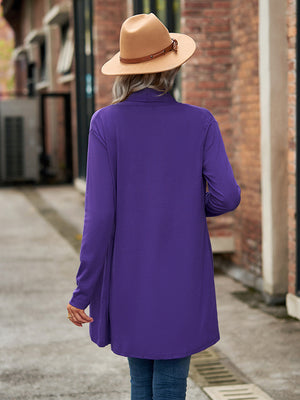 Electric purple asymmetrical cardigan with a draped front and long sleeves.