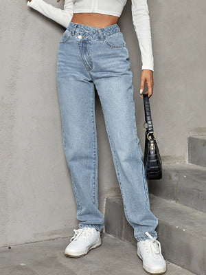 Light wash denim jeans with asymmetric waistband and straight leg cut.