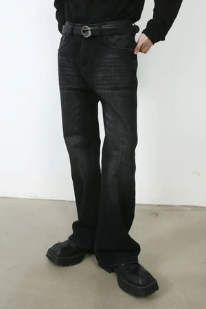 Faded black denim flare jeans with a casual, chic style.