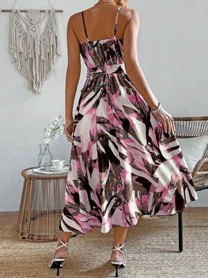 Belted cami midi dress with vibrant abstract print in fuchsia pink, white and brown.