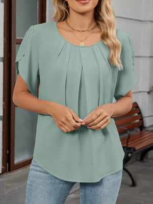 Mint green polyester blouse with short sleeves, round neckline, and front pleats.