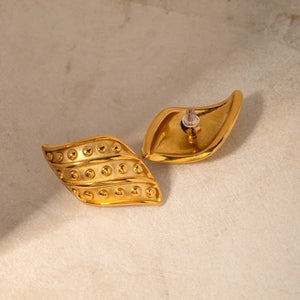 Sculpted gold leaf stud earrings with raised dot pattern, 18K gold-plated.