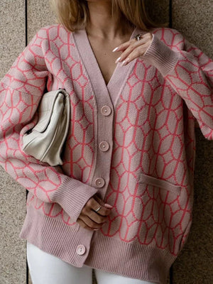 Dusty pink acrylic geometric knit button-up cardigan with V-neck and pockets.