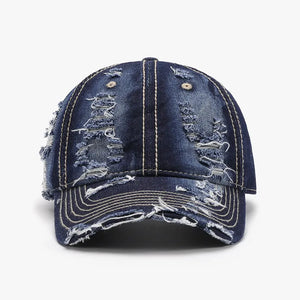 Dark ripped denim baseball cap with distressed details and contrast stitching.