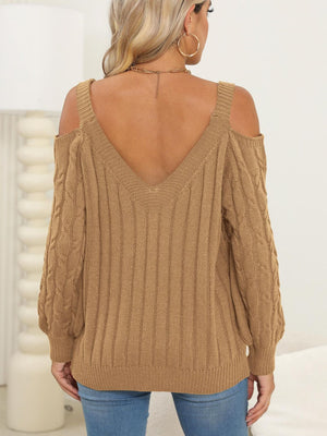 Camel cable knit cold shoulder sweater with V-neck and balloon sleeves.