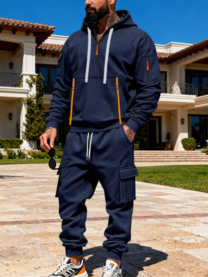 Navy blue half-zip hoodie and cargo pants set with orange zipper accents and white drawstrings.