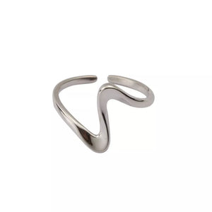 Wavy minimalist sterling silver ring with an open band design.
