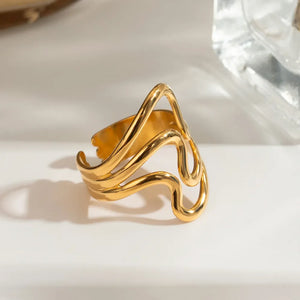 Gold sculptural wave ring with abstract design