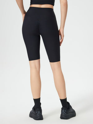 Black ribbed contour cycling shorts with ruched detail on the back.