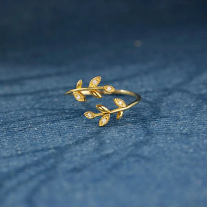 Gold branching zirconia vine ring with delicate leaf design