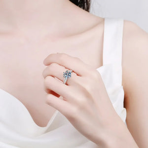 Sterling silver ring with pavé band and 3-carat moissanite solitaire.