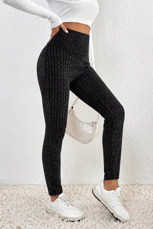 Textured knit sculpting leggings in black with a ribbed pattern.