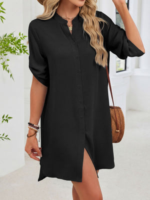 Black button-down shirt dress with band collar and rolled sleeves.