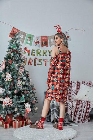 Cold shoulder dress in red plaid with gingerbread men and Christmas trees, long sleeves, mini length.