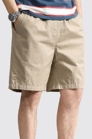 Khaki chino shorts with pockets, above the knee length, casual style.