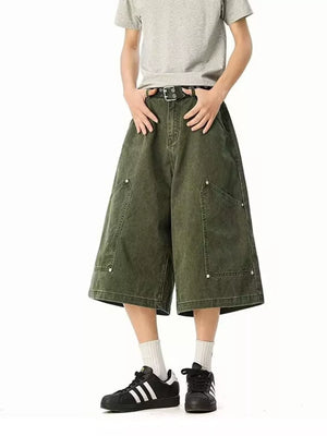 Army green relaxed fit utility cargo shorts with wide legs and multiple pockets.