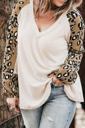 White waffle knit top with leopard print sleeves and V-neck